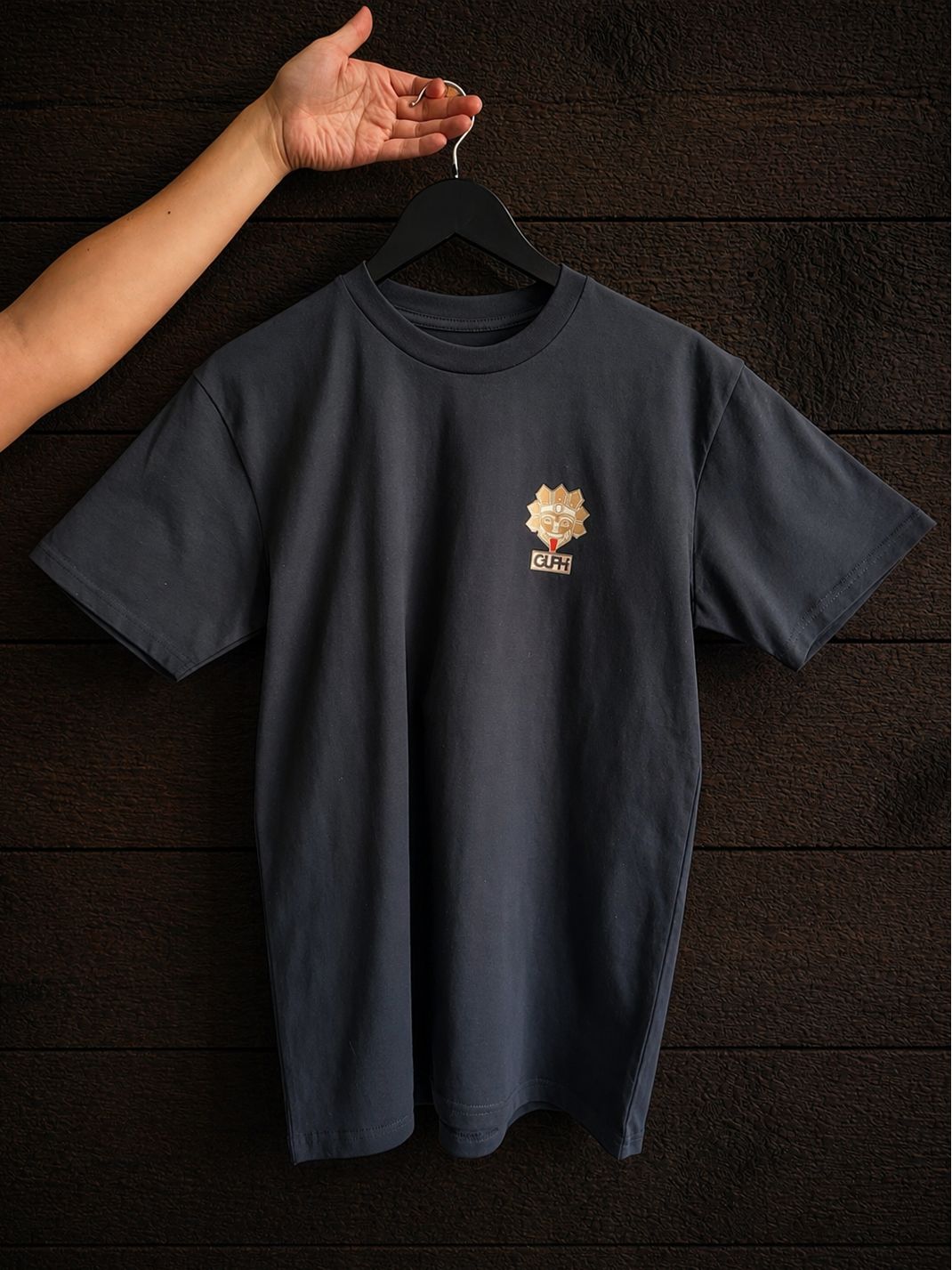 Product shot of the front print of the Cactus Bloom Classic Tee in Navy, featuring the GUPHI logo over the left chest