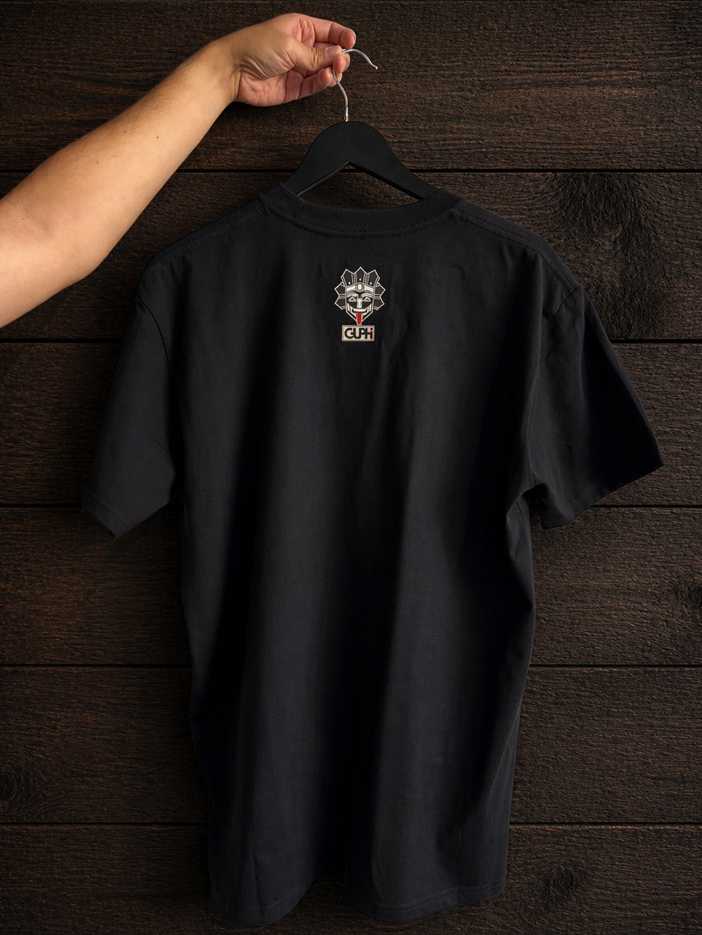 Product shot of the back print of the Island Born Desert Built Classic Tee in Black