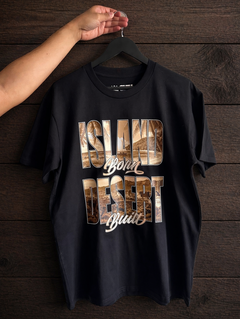 Product shot of the front print of the Island Born Desert Built Classic Tee in Black