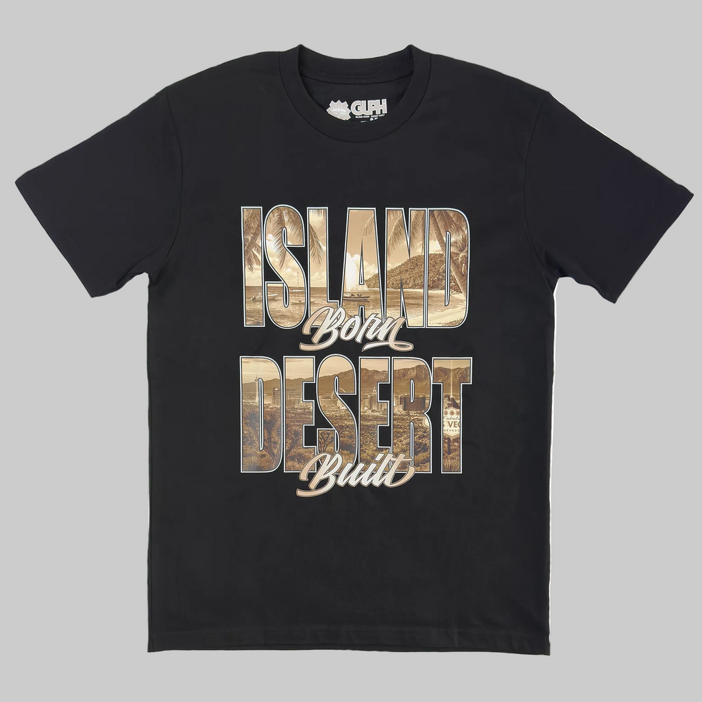 The front print of the Island Born Desert Built Classic Tee in Black. Features a beach scene within the word "Island" and the desert landscape and Las Vegas strip within the word "Desert"