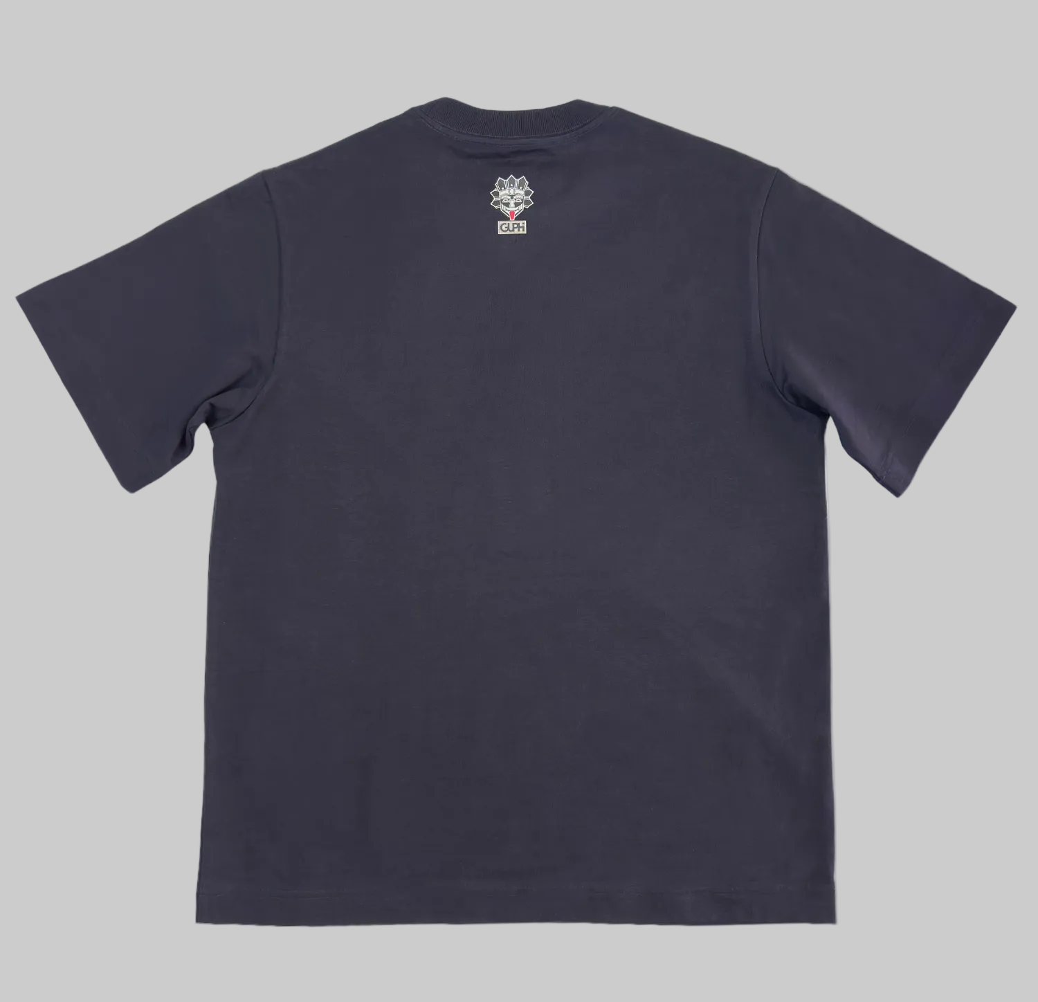 Back of the Motto Box Tee in Ink Blue with a small GUPHI logo on the center of the neckline